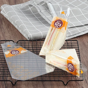 100vnt Sutirštinkite trikampį duonos sumuštinių pakavimo maišelį Vienkartinis skaidrus kepimas Kepykla Maistas Lengvas maistas Plastikinis plėvelė Tortų popierius
