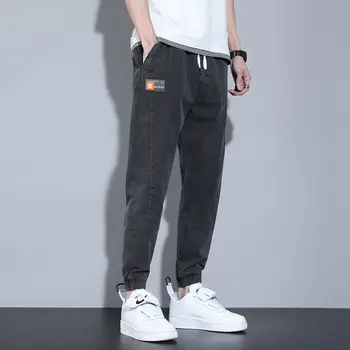 2022 Naujo dizaino sutraukiamas raištis Laisvas prigludimas Haremo džinsai vyrams Madingos korėjietiško stiliaus džinsinės kelnės Laisvalaikio darbo drabužiai Kaubojiškos krepšio kelnės