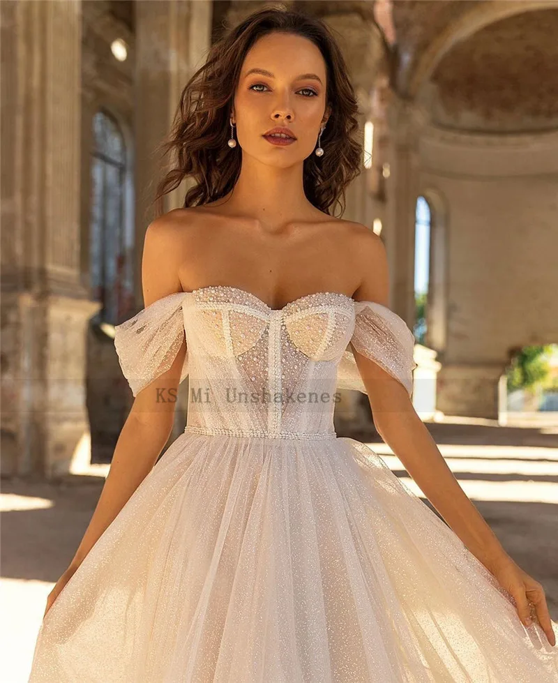 Smėlio blizganti vestuvinė suknelė 2021 off Shoulder A Line Beach Nuotakos suknelės Glitter Tiulio korsetas Atgal Vintažiniai seksualūs vestuviniai chalatai